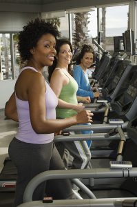Women Exercising on Treadmills at Health Club