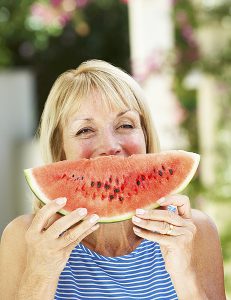 Woman holding water melon