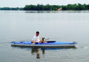 Greg with Rusty in a kayak