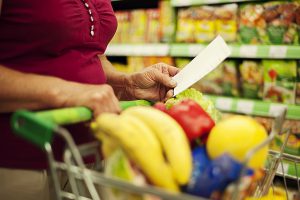 shopper looking at list