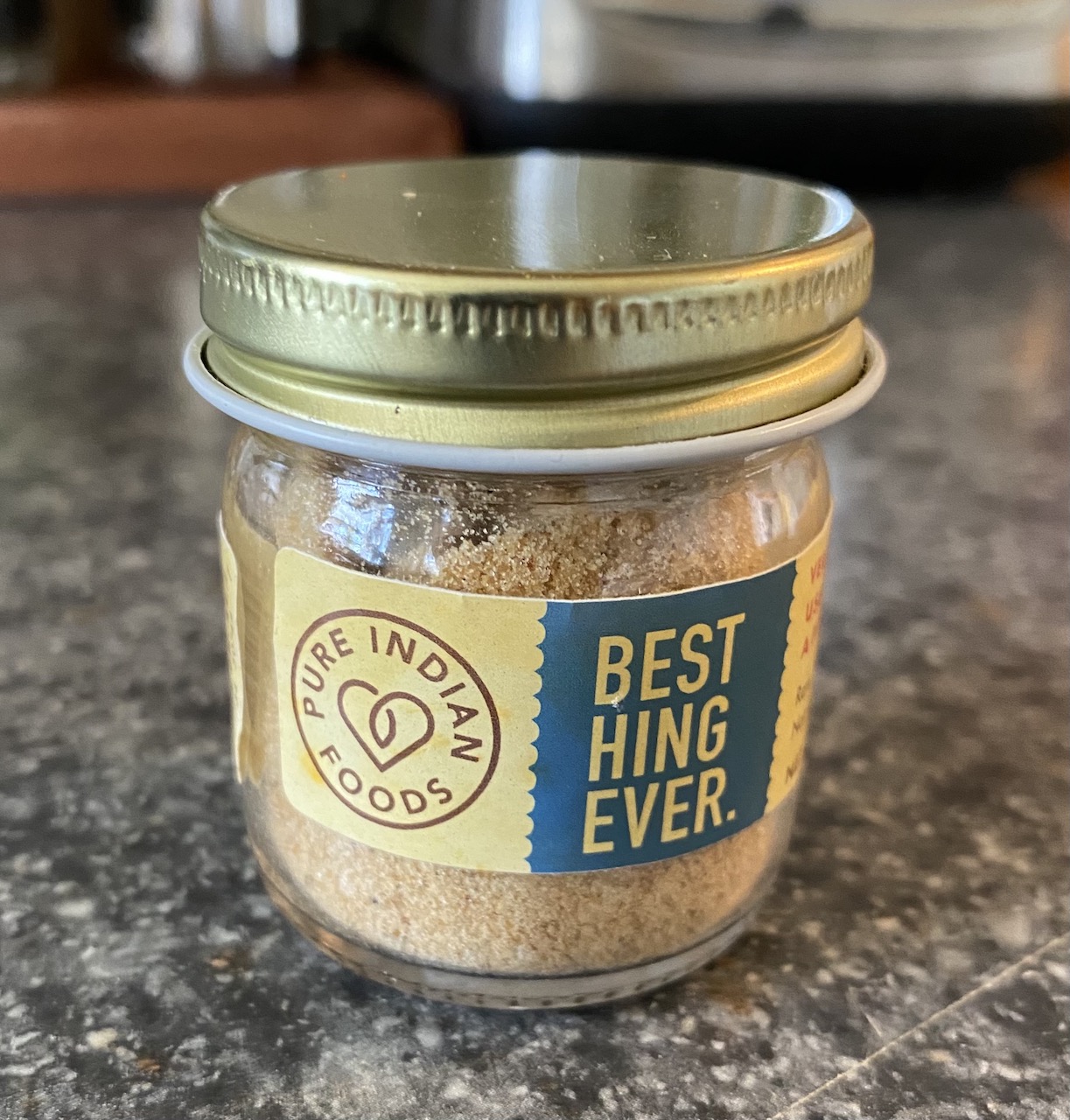 "small glass spice jar that reads Best Hing ever from Pure Indian foods"