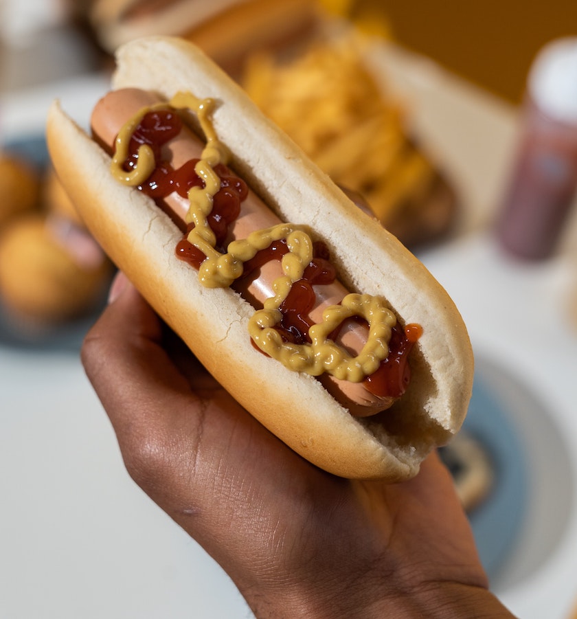 A hot dog with ketchup and mustard